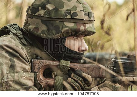 Military Woman With A Rifle