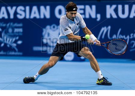 KUALA LUMPUR, MALAYSIA - OCTOBER 02, 2015: Spain's David Ferrer hits a backhand return in his match at the Malaysian Open 2015 tennis tournament held at the Putra Stadium, Malaysia. 