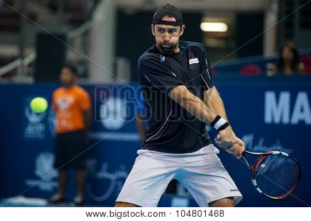 KUALA LUMPUR, MALAYSIA - OCTOBER 03, 2015: Germany's tennis player Benjamin Becker plays a backhand return at the 2015 Malaysian Open tennis tournament from Sep 26 - Oct 4, 2015 in Stadium Putra.