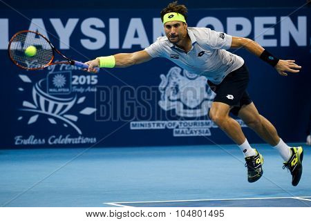 KUALA LUMPUR, MALAYSIA - OCTOBER 03, 2015: Spain's tennis player David Ferrer stretches to make a forehand return at the 2015 Malaysian Open tennis tournament held in the Stadium Putra.