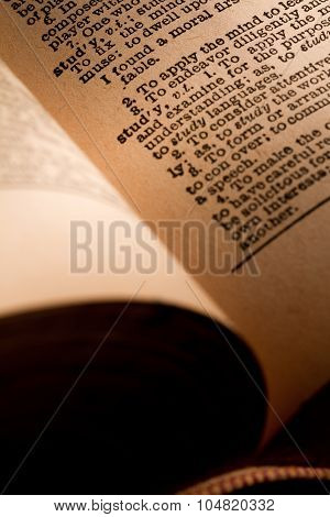 Close-up Of An Opened Dictionary Showing The Word Study