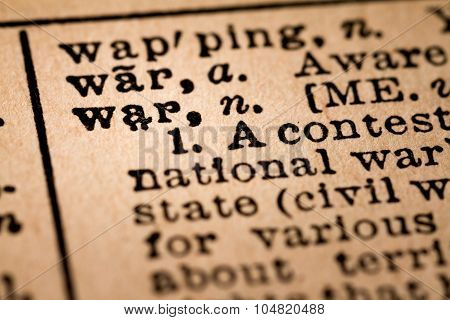 Close-up Of An Opened Dictionary Showing The Word War