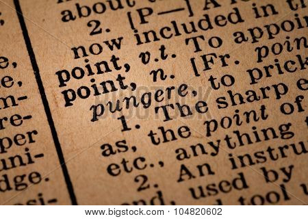 Close-up Of An Opened Dictionary Showing The Word Point