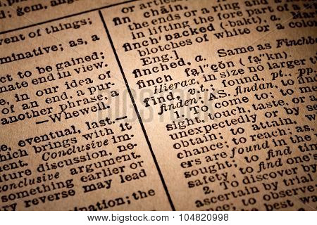 Close-up Of An Opened Dictionary Showing The Word Find