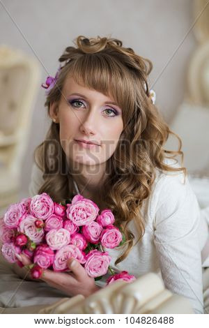Beautiful Blonde Girl With A Bouquet Of Flowers