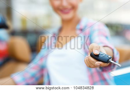 Woman Standing Near A Convertible With Keys In Hand - Concept Of Buying A Used Car Or A Rental Car