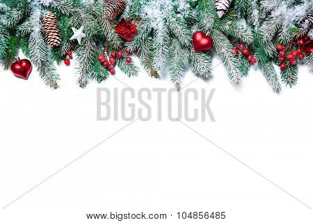 Christmas Border. Tree branches with baubles, stars, snowflakes isolated on white