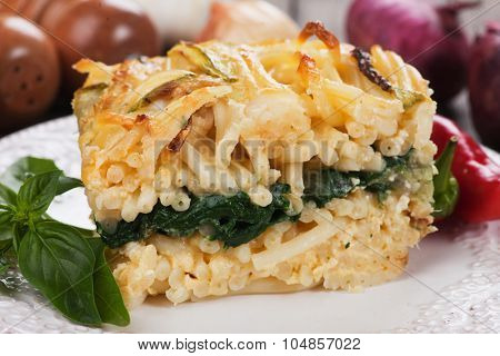 Pasticcio or pastitsio with chard and zucchini, italian baked pasta