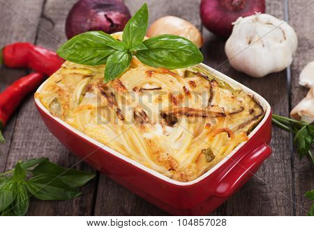 Pasticcio or pastitsio with zucchini and cheese, italian baked pasta