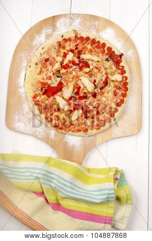 Wooden Board With A Chicken, Red Onion And Hot Chilli Pizza