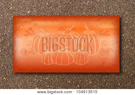 Autumn card on sand