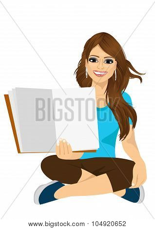 woman showing the open pages of her book