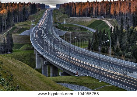 Speedway In Russian Forest At Sunset.