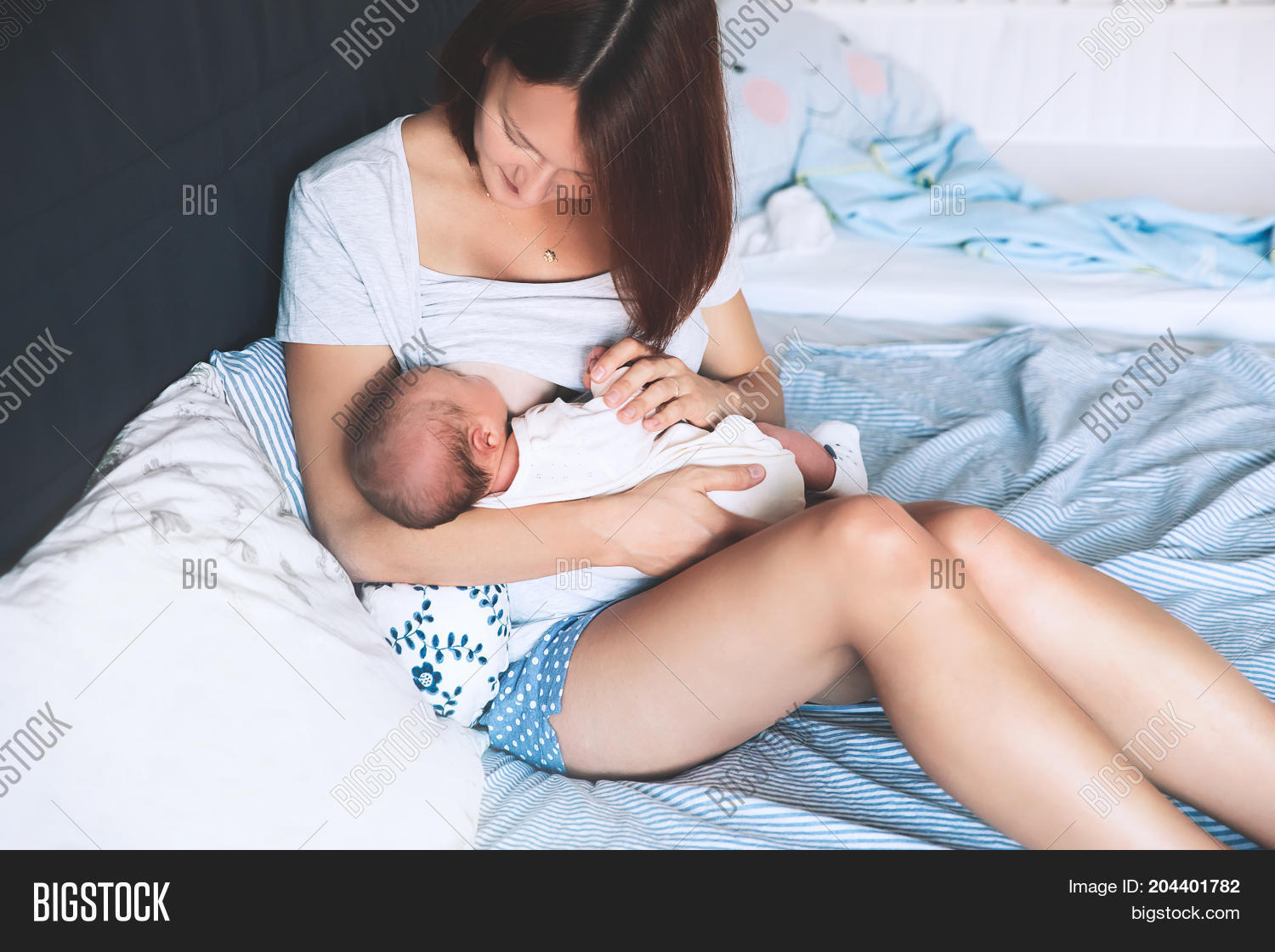beautiful mom breastfeeding baby