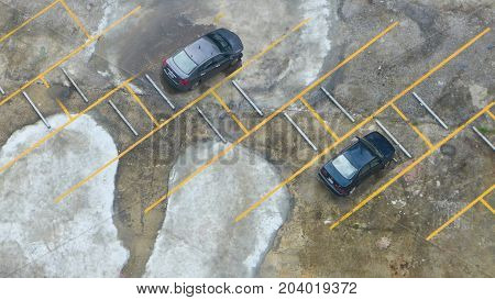 two cars in car parking on top view