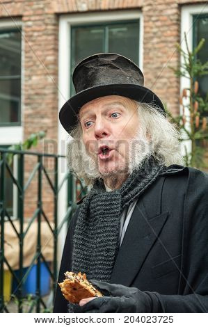 Deventer Netherlands - December 18 2016: Scrooge one of the characters from the famous books of Dickens during the Dickens Festival in Deventer in The Netherlands