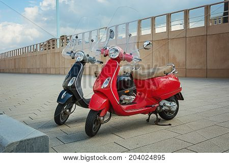 Scheveningen The Netherlands - August 9 2017: Two trendy scooters parked on the boulevard in Scheveningen in Netherlands