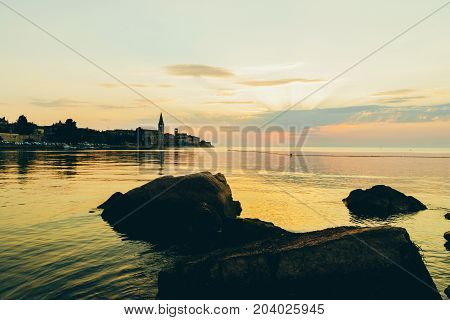 Sunset On The Seashore. City View Walk Along The Seafront