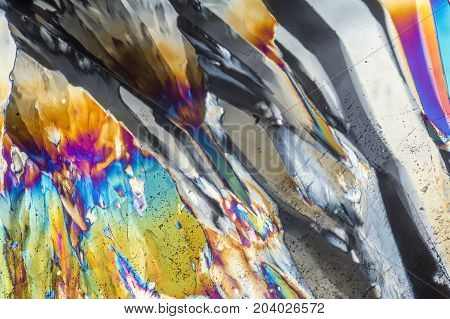 colorful microscopic shot of Trisodium citrate microcrystals in polarized light