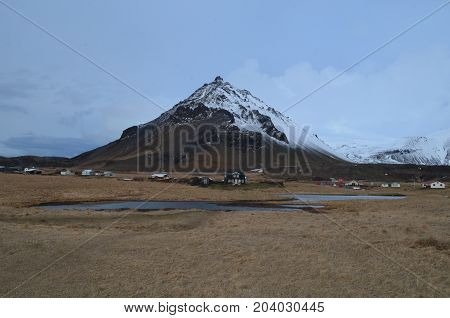 Snow dusting the top of Mount Stapafell in Iceland.