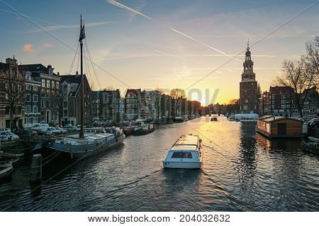 Amsterdam Netherlands - January 5 2017: View on the canal Oudeschans at Sunset in the center of Amsterdam.