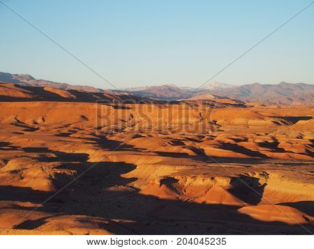 Desert and high ATLAS MOUNTAINS range landscape in central MOROCCO seen from ksar of Ait-Ben-Haddou near Ouarzazate city with clear blue sky in 2017 warm sunny winter day, northern Africa on February.