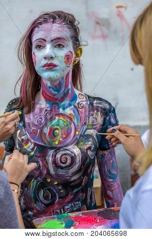 TIMISOARA ROMANIA - SEPTEMBER 8 2017: Face and body painting of a woman. 3D art symbolizing on live at the street inside the CheckART Carnival organized by the City Hall Timisoara. Liberty Square.