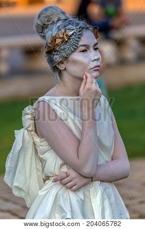 TIMISOARA ROMANIA - SEPTEMBER 8 2017: Living statue of a woman dressed with antical elements and present on the street inside the CheckART Carnival organized by the City Hall Timisoara. Union Square