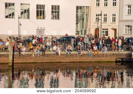Lubeck Germany - May 25. 2017: People enjoying sunny evening on the pier