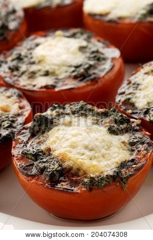 Stuffed tomatoes with cheese baked in the oven