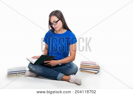 Beautiful Student Girl Sitting On Blanket And Studying