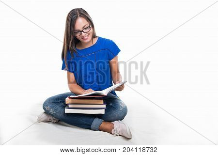 Beautiful Student Girl Sitting And Studying From Books
