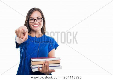 Portrait Of Student Girl Holding Books Pointing Camera