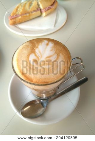 Breakfast cafe au lait and ham sandwich