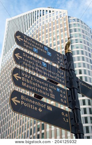 The Hague the Netherlands - 26 November 2016: street direction sign in The Hague with tall building in background