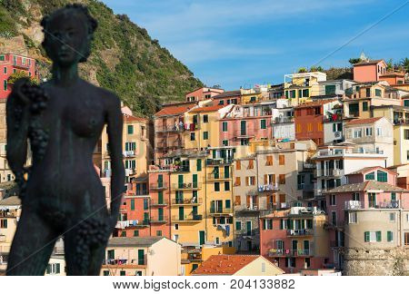 Statue della Vendemmia in Manarola in National park Cinque Terre, Liguria, Italy