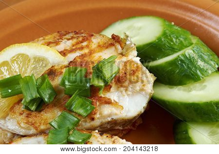 grilled t-bone codfish steak and vegetables,  , close up traditional meal