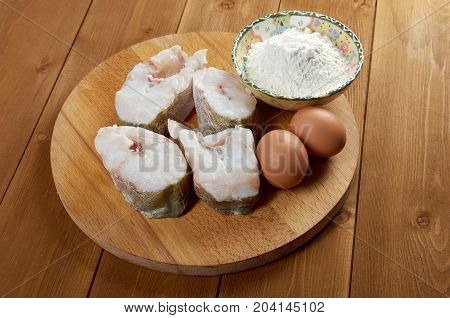 codfish steak .prepared fisheggflour , close up