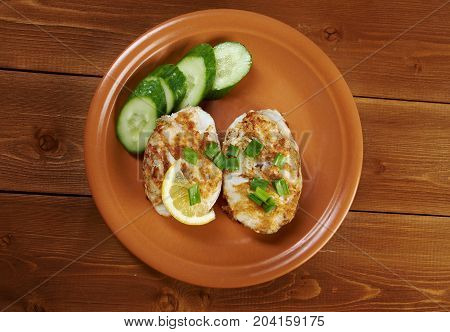 grilled t-bone codfish steak and vegetables , close up meal