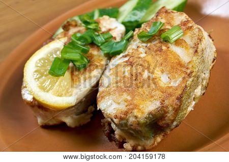 grilled t-bone codfish steak and vegetables , close up meal