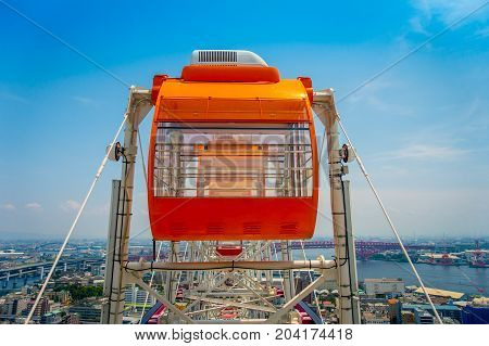 OSAKA, JAPAN - JULY 18, 2017: Close up of Tempozan Ferris Wheel in Osaka, Japan. The wheel has a height of 112.5 metres, it's opened in 1997, situated in Tempozan Harbor Village.