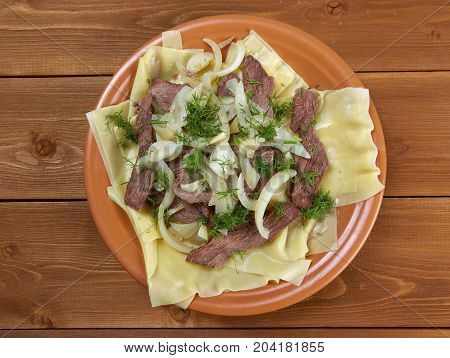 Beshbarmak: Traditional meat asian cuisine close up traditional meal