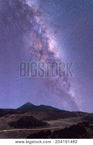 The milky way in night sky over Mount Bromo volcano (Gunung Bromo) in Bromo Tengger Semeru National Park East Java Indonesia..