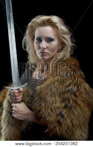 Valkyrie.Viking girl with sword woman, close up
