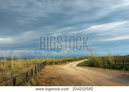 Sandy curved country road in the autumn day. Montenegro