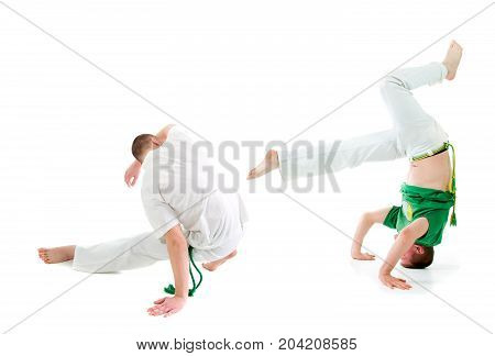 Contact Sport . Capoeira. training over white background