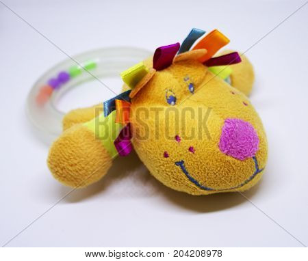 Plastic baby rattle for theething with dog's head