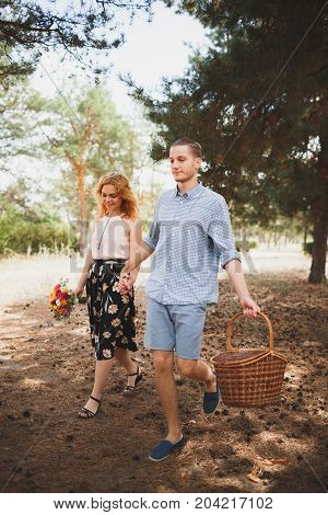 Happiness and love are in the air. Woman and man in the forest. Outdoors concept.