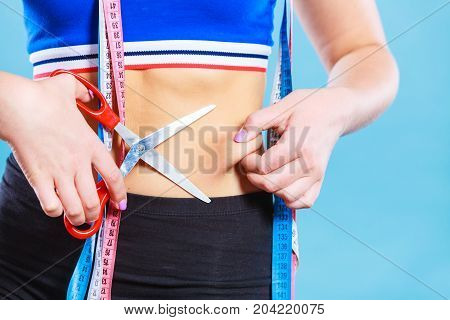 Woman Pinching Waist For Skin Fold Test