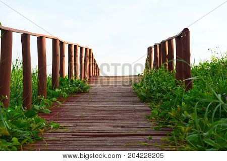 picture took of a bridge ,from the street to the beach